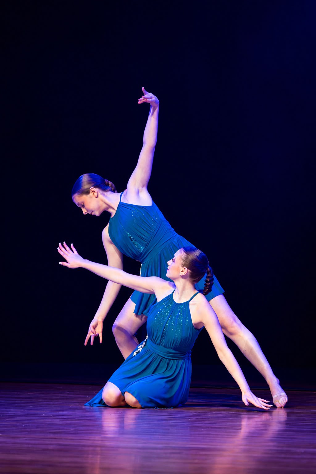 Elevate dancers performing a group contemporary piece